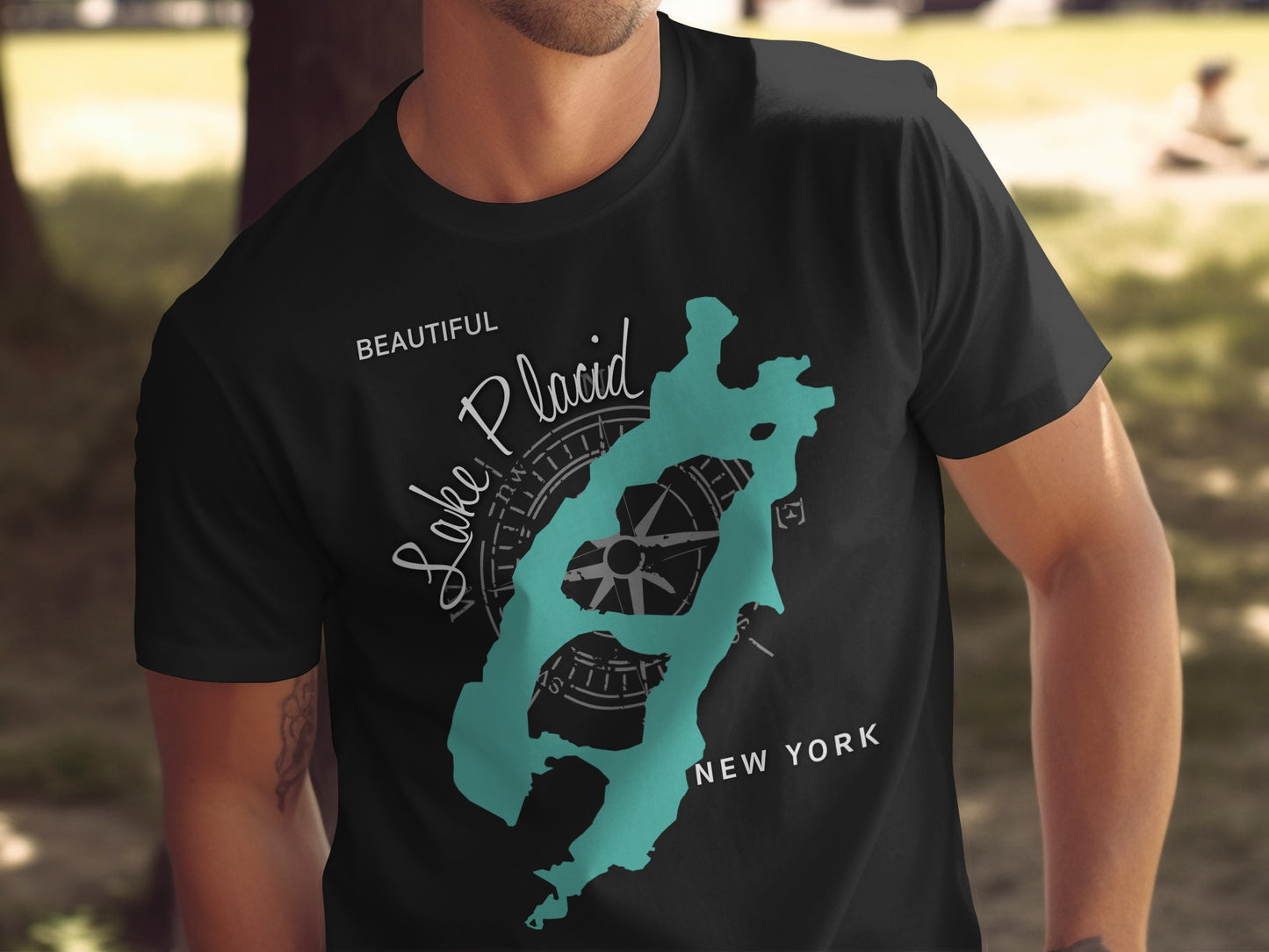 Black t-shirt with Lake Placid, New York map and compass graphic.