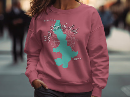 Pink sweatshirt with "Beautiful West Okoboji Lake Iowa" and compass graphic.