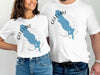 White t-shirts with blue Gull Lake, Michigan map and compass graphic.