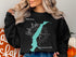 Black sweatshirt with "Beautiful Yale Lakes Washington" and compass design.