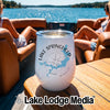 White insulated wine tumbler with Lake Springfield Missouri compass design on a boat table.