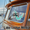 Turquoise lake outline sticker with "Castaic Life" text on boat window.