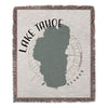 Lake Tahoe map design on a fringed woven throw blanket.