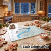 Glass cutting board featuring a Lake Ullswater map and compass design on a holiday-decorated kitchen counter.