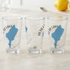 Three clear glasses with blue Alta Lake map and compass graphics.