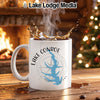 White mug with Lake Conroe map and compass design, steaming coffee splashing.