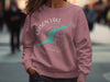 Pink sweatshirt with "Mason Lake Washington" and lake outline design.