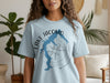 Blue t-shirt with Lake Jacomo Missouri map and compass graphic, on a person.