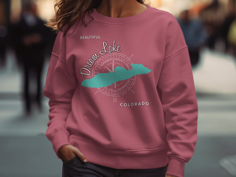 Pink sweatshirt with Dream Lake Colorado compass graphic.