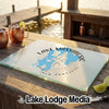 Glass cutting board featuring a blue map graphic of Lake Massabesic, New Hampshire, on a wooden outdoor bar.