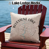 Cream pillow with "Bluestone Lake West Virginia" and compass graphic on chair.