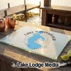 Glass cutting board featuring a map of Lake Tohopekaliga, Florida, on a wooden outdoor table.