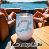 A white insulated wine tumbler with a Lake Jackson, Georgia graphic sits on a wooden boat table.
