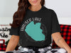 Black t-shirt graphic of Hauser Lake, Idaho, with compass rose and "IDAHO" text.