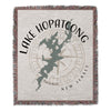 Woven blanket featuring Lake Hopatcong map with compass and "New Jersey" text.