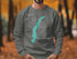 Dark grey sweatshirt with teal map of Lake Wenatchee and compass rose.
