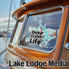 Duct tape sticker with "Deep Creek Life" text and map on boat window. Lake Lodge Media logo on bottom.