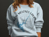 Light blue sweatshirt with New Melones Lake California graphic and compass design.