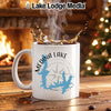 White mug with Medina Lake, Texas map and compass on wood table.