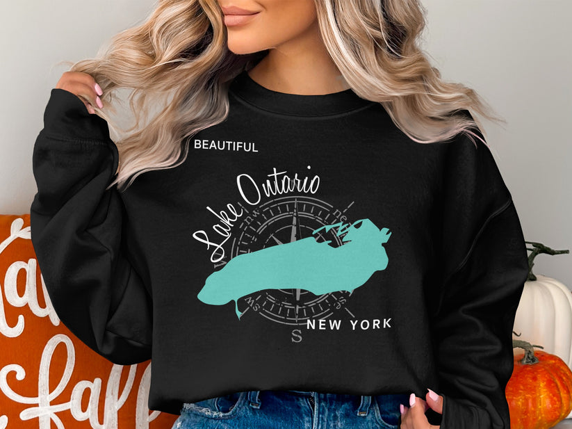 Black sweatshirt with a teal map of Lake Ontario and compass rose graphic.
