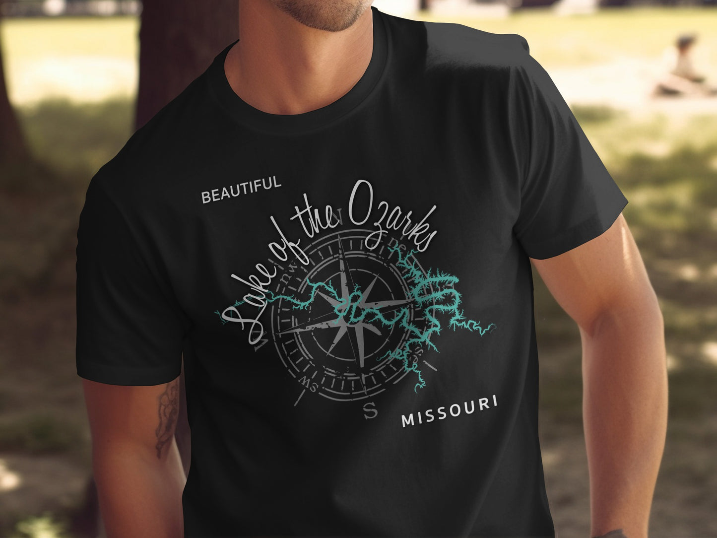 Black t-shirt with "Lake of the Ozarks" text and compass design.
