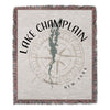 Woven throw blanket with Lake Champlain map and compass design, New York.