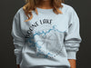 Light blue crewneck sweatshirt with Boone Lake Tennessee graphic and compass design.