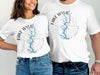 White t-shirts with "Lake Wylie South Carolina" and a compass design.