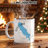 White mug with Gull Lake, Michigan map and compass design, with splashing coffee.
