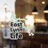 "East Lynn Life" sticker with turquoise outline of a lake shoreline.