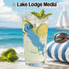 Glass with a lake map design on a beach with sunglasses and limes.