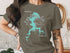 T-shirt featuring a teal map outline of Grassy Lake with compass rose.