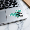 Turquoise sticker with black text "Brooks Hess Life" on a laptop.