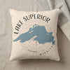 Cream pillow with Lake Superior map, compass, and text.