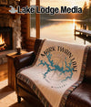 Tapestry with Mark Twain Lake map and compass rose on leather couch.