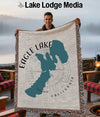Man holding a throw blanket with the map of Eagle Lake, California.