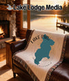 Lake Piru California map blanket on leather couch with fireplace view.