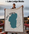 Woven blanket featuring a teal Lake Tahoe map with "Lake Tahoe Nevada" text.