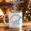 White mug with "Possum Kingdom Lake Texas" and map graphic in front of a fireplace.