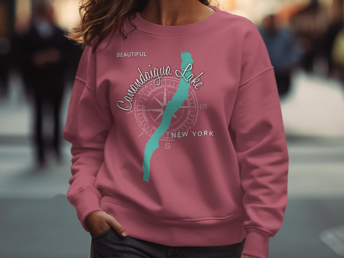 Pink sweatshirt with "Canandaigua Lake New York" text and compass graphic.
