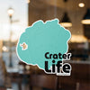 Teal Crater Life sticker with copyright Lake Lodge Media LLC.