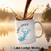 White mug with Lake Lanier map design and compass, coffee splash.
