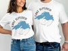 White t-shirts featuring a blue map of Lake Superior within a compass design.