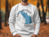 White sweatshirt with "Lake Lawtonka Oklahoma" map graphic and compass rose.