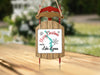 Sled ornament with "Merry Christmas From Lake Lyman" text and a lake graphic.