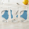 Three clear glasses with blue Emerald Lake map graphics and text.
