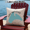 Light beige pillow with blue Lake Manawa map and compass design on Adirondack chair.