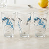 Three clear glasses with Evergreen Lake Illinois map and compass design.