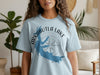 Light blue t-shirt with Arkabutla Lake Mississippi map and compass design.