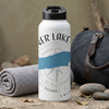 White water bottle with "ER LAKE" text and compass design on a textured background.